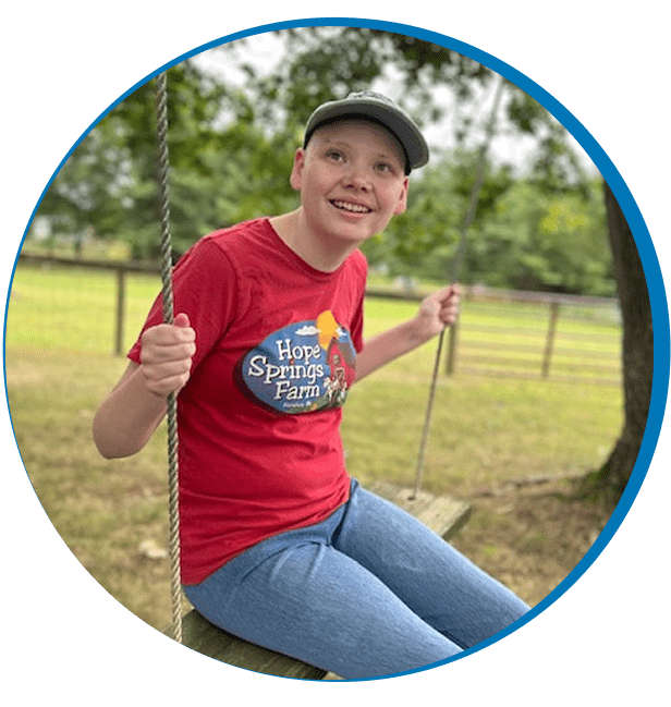 Happy person on a swing in nature