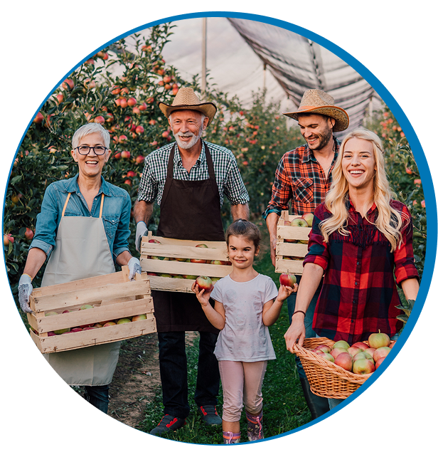 Group smiling with apple baskets