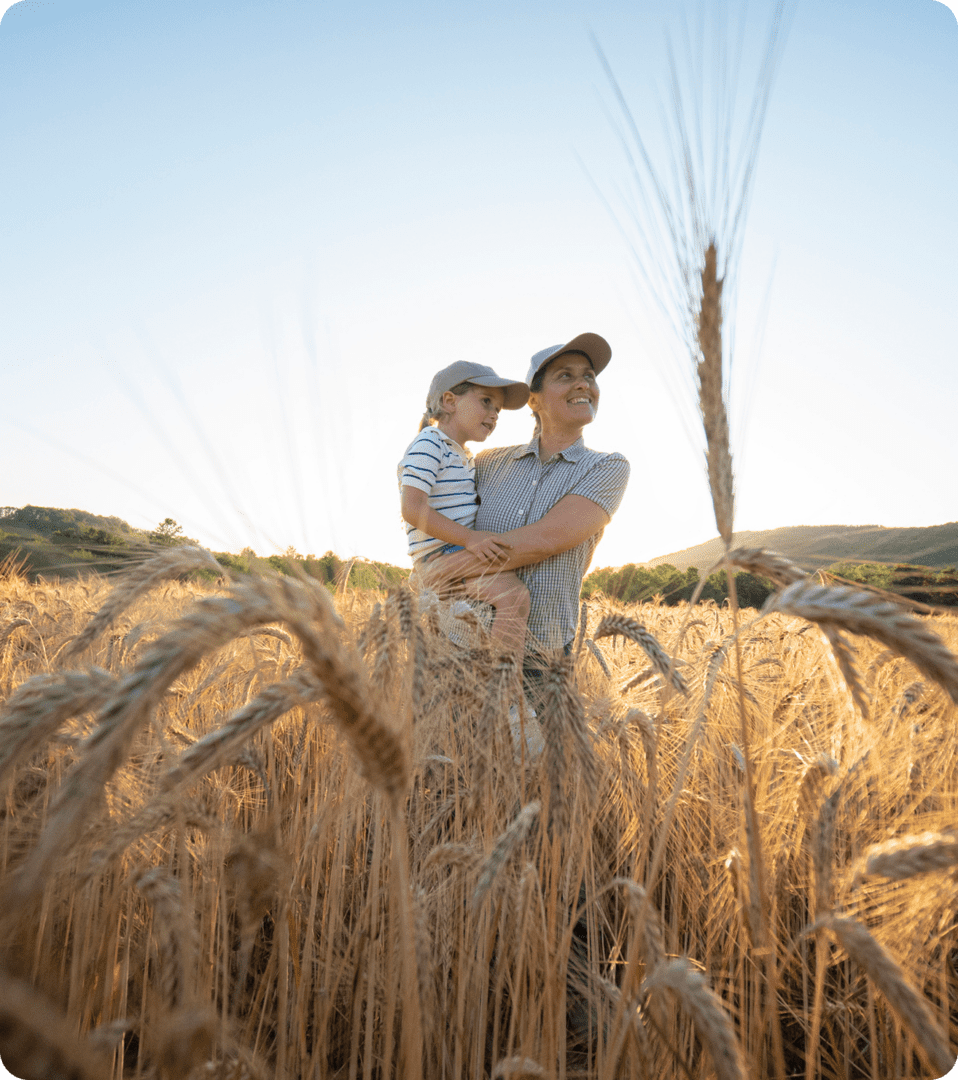 Father and child in wheat field